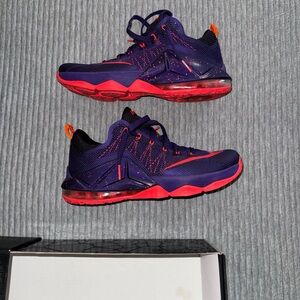 Nike LeBron 12 Low sneakers in a Court Purple colorway.